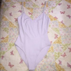 A light blue body suit